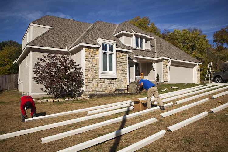 K-Guard Technicians Installing a Seamless Gutter System - K-Guard St. Louis